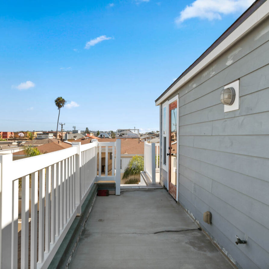 726 & 728 Ensenada Combined Photo 33 3rd Floor Side Patio with Master Bedroom Door View